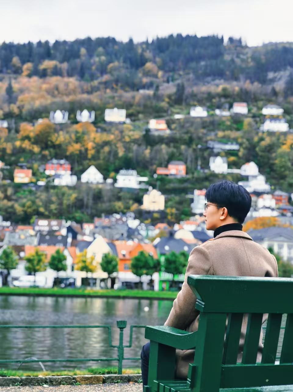Shuai Ma sitting by the water